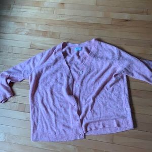 Pink cardigan with white buttons
